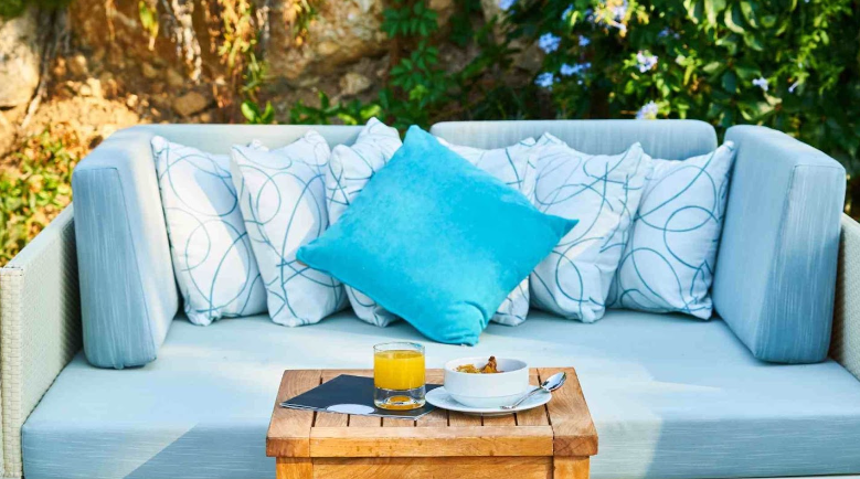 featured image of the blog titled "The Role of Cushions and Throws in Enhancing Patio Furniture"
